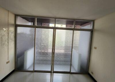 Empty living room with frosted glass sliding doors