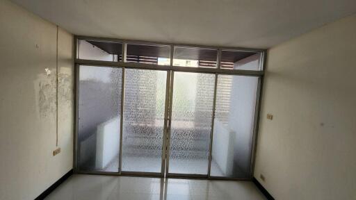 Empty living room with frosted glass sliding doors