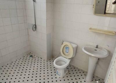 Bathroom with tiled walls and floor