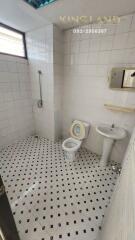 Bathroom with tiled walls and floor