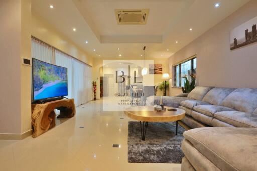 Modern living room with sectional sofa and large TV