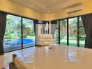 Bedroom with pool view and large windows