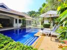 Outdoor area with swimming pool and lounge chairs