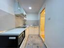 Modern kitchen with appliances and tiled floor