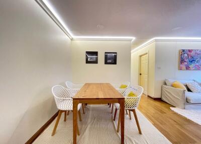 Dining area with wooden table and chairs