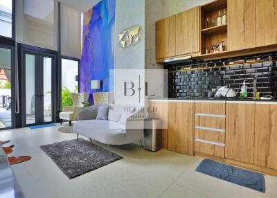 Modern living area with kitchen in open layout