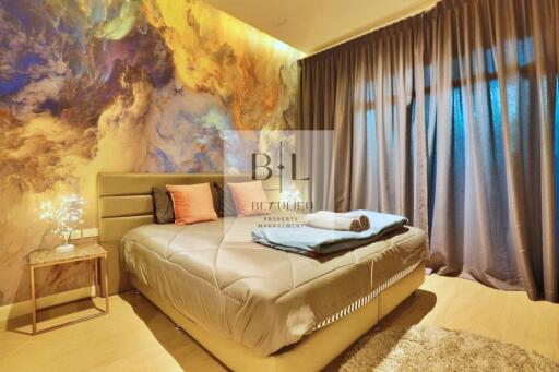 Luxury modern bedroom with artistic wall, gray curtains, and neatly arranged bed