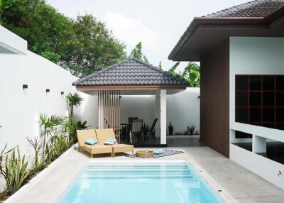 Modern backyard with pool and lounge area