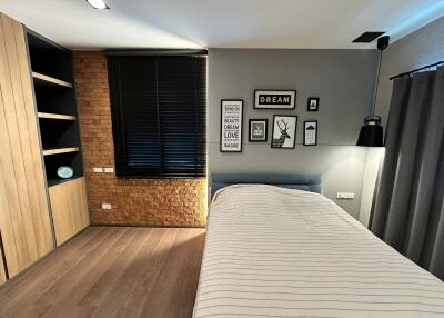 Modern Bedroom with Wooden Elements and Wall Art