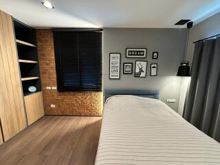 Modern Bedroom with Wooden Elements and Wall Art