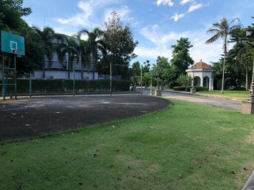 Outdoor basketball court and garden area