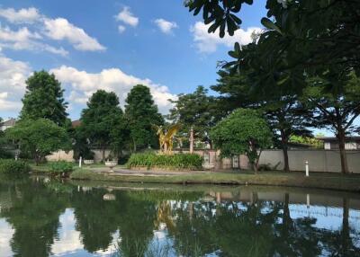 Manicured garden with pond and sculpture