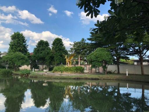 Manicured garden with pond and sculpture