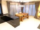 Dining area with wooden table and modern lighting