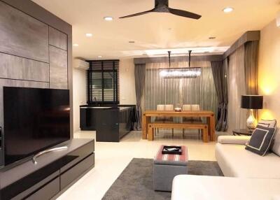 Modern living room with open dining area and kitchen