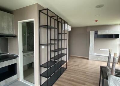 modern living room with shelving and wooden flooring