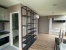 modern living room with shelving and wooden flooring