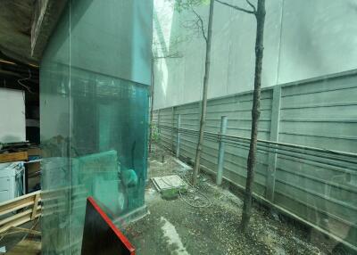 View of the outdoor area with glass windows and trees