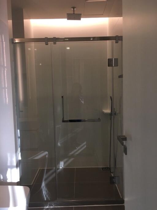 Modern bathroom with glass shower door