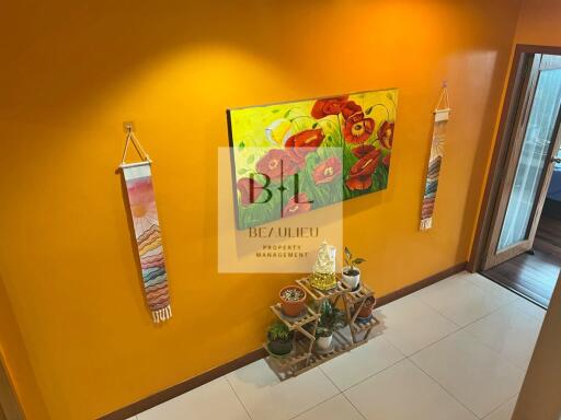 Colorful hallway with plants and wall decor