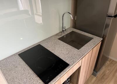 Modern kitchen with cooktop and sink