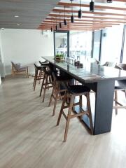 Modern dining area with high chairs and wooden accents