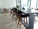 Modern dining area with high chairs and wooden accents