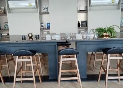 Modern kitchen with bar seating and open shelving