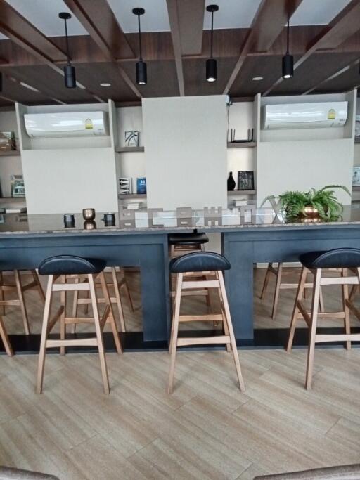 Modern kitchen with bar seating and open shelving