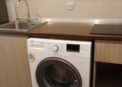 Modern kitchen with washing machine