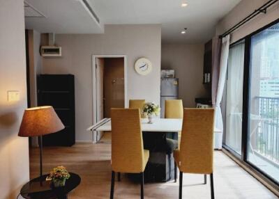 Modern dining area with natural light and city view