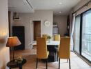 Modern dining area with natural light and city view