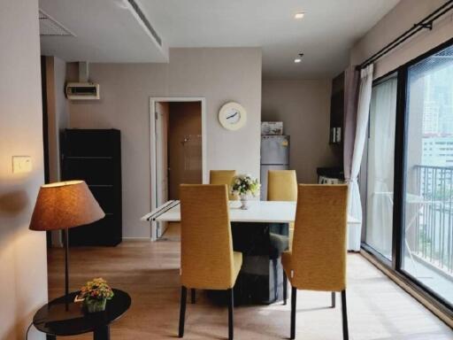 Modern dining area with natural light and city view