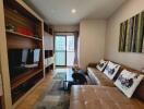 Modern living room with cozy brown couch and entertainment center