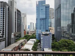 View of city skyscrapers from a high floor balcony