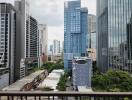 View of city skyscrapers from a high floor balcony