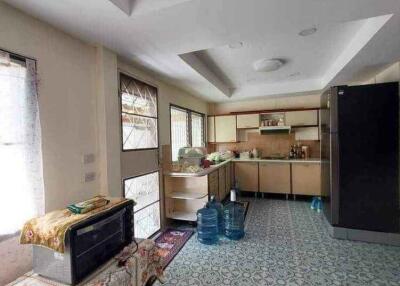 Spacious and well-lit kitchen with modern appliances