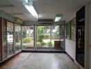 Spacious living area with large windows and garden view