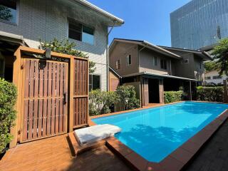 Outdoor area with swimming pool and nearby houses