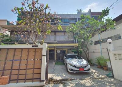 Front view of a house with driveway and garden