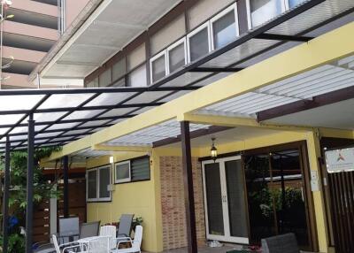 Outdoor patio with seating area and covered roof