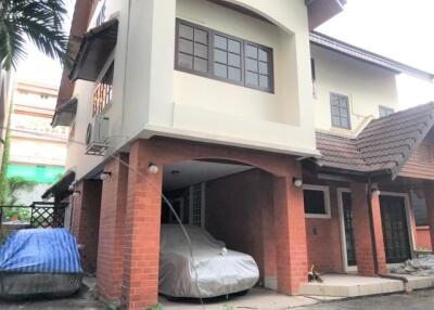 Two-story house with carport