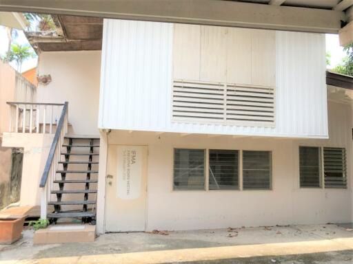 Two-story exterior building with stairs