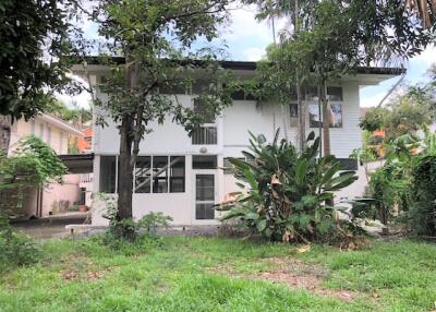 Front view of residential house with trees