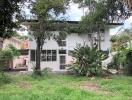 Front view of residential house with trees