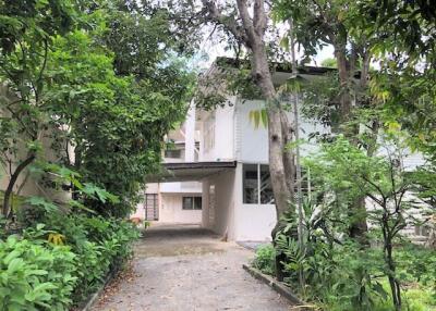 Exterior view of a building surrounded by greenery