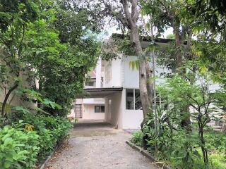 Exterior view of a building surrounded by greenery