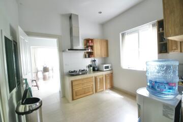 Modern kitchen with wooden cabinets and appliances