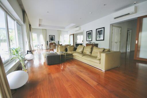 Spacious living room with wooden flooring and modern furnishings