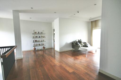 Spacious living room with wooden floor